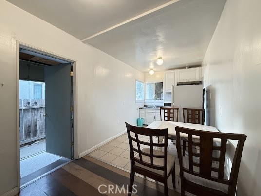 dining room with light tile patterned flooring