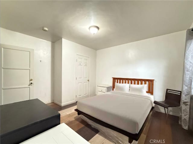 bedroom with light hardwood / wood-style flooring