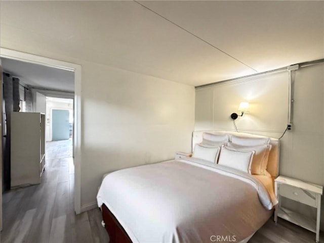 bedroom featuring dark hardwood / wood-style floors