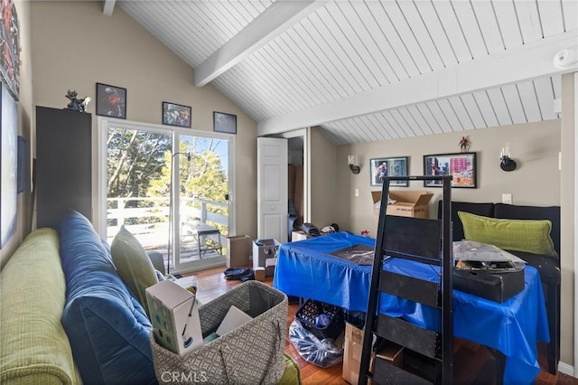 bedroom featuring hardwood / wood-style flooring and lofted ceiling with beams