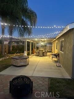 patio at twilight with a fire pit