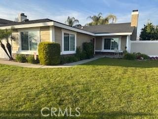 view of front facade with a front yard