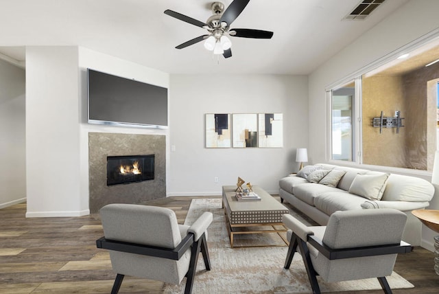 living room with ceiling fan and hardwood / wood-style floors