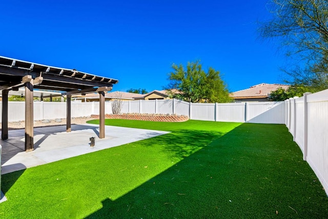 view of yard with a pergola and a patio area