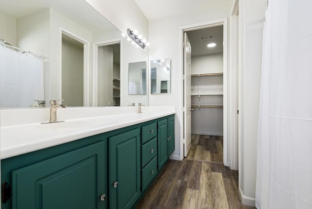 bathroom featuring wood-type flooring and vanity