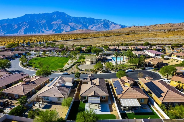 birds eye view of property with a mountain view