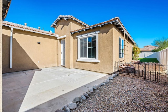 back of house with a patio area