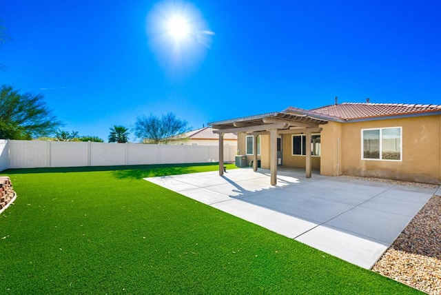 rear view of house featuring a patio area, a yard, and a pergola