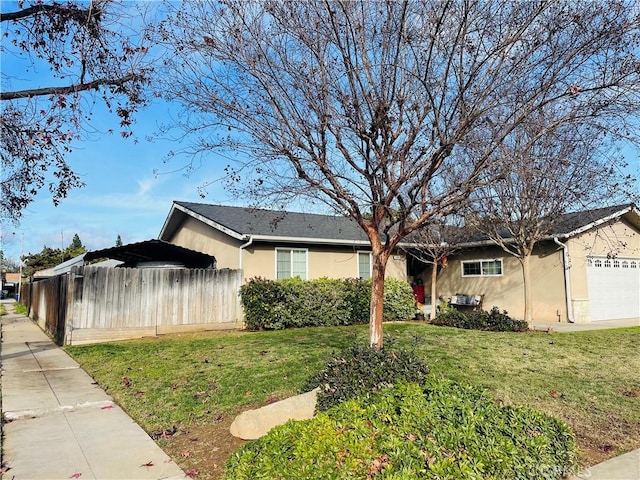 view of home's exterior featuring a garage and a lawn