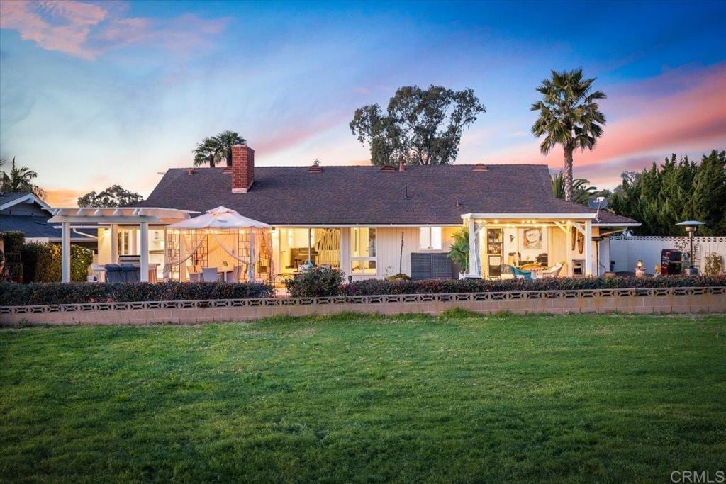 ranch-style house with a yard