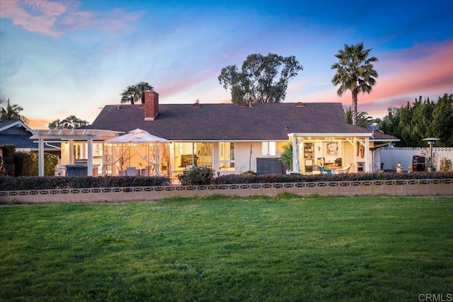 ranch-style house with a yard