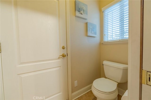 bathroom with tile patterned floors and toilet