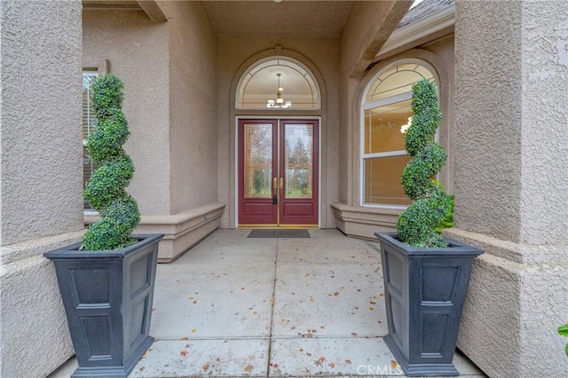 view of exterior entry featuring french doors