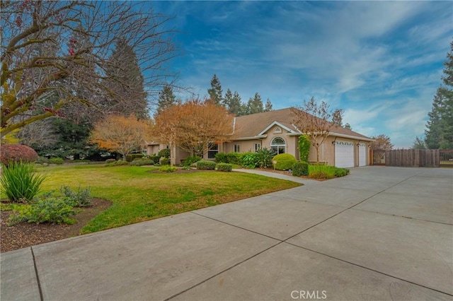 single story home featuring a front lawn and a garage