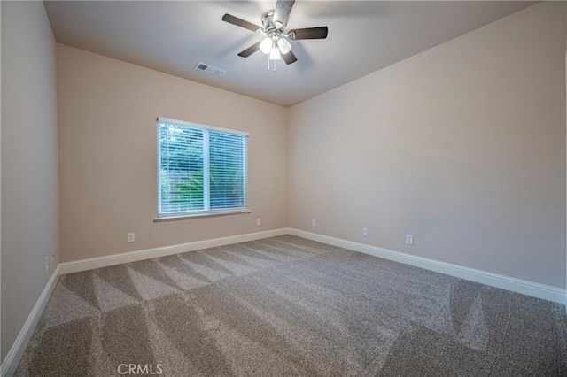 empty room with carpet and ceiling fan