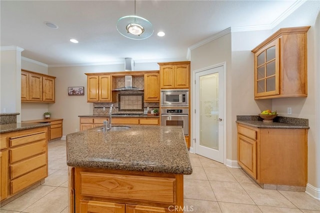 kitchen with light tile patterned floors, appliances with stainless steel finishes, a kitchen island with sink, wall chimney range hood, and ornamental molding