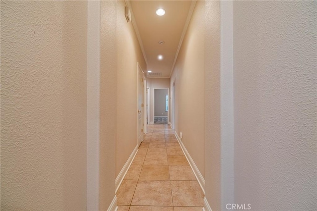 hallway featuring light tile patterned floors