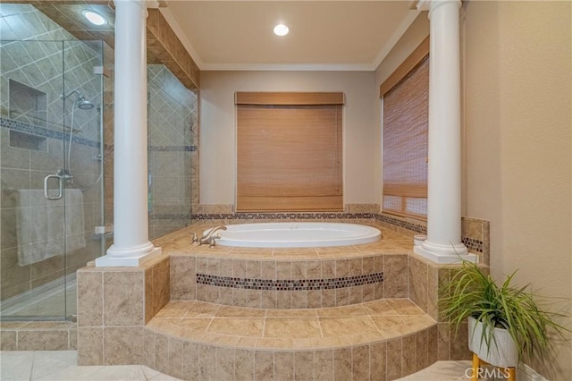 bathroom with decorative columns, ornamental molding, and plus walk in shower