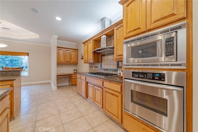 kitchen featuring decorative backsplash, stainless steel appliances, ornamental molding, light tile patterned floors, and dark stone counters