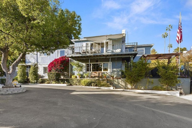 view of front of home with a balcony