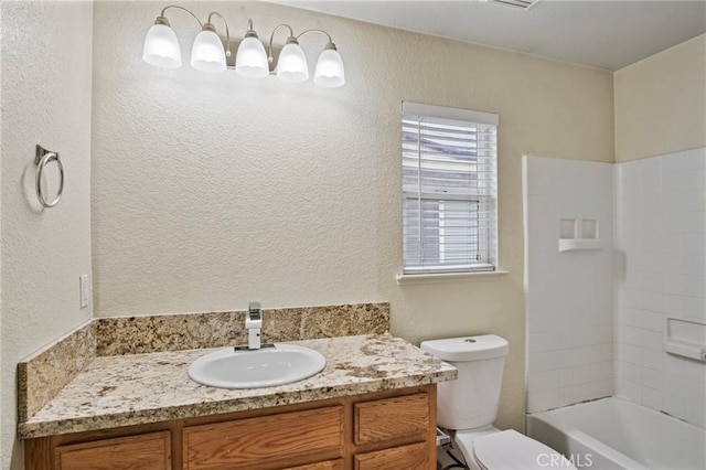 full bathroom with toilet, vanity, and shower / washtub combination