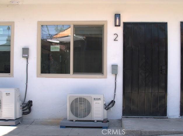 property entrance with ac unit