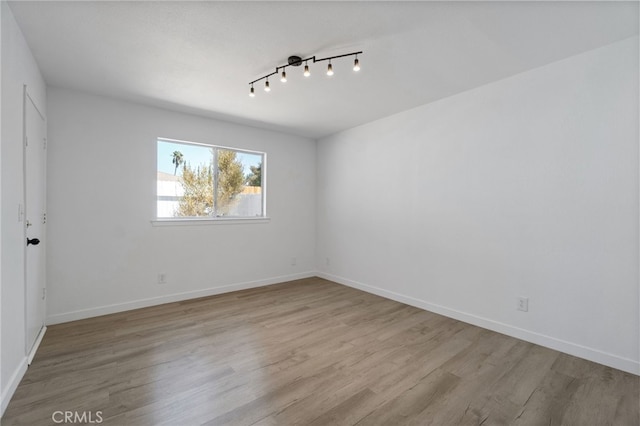 unfurnished room featuring light hardwood / wood-style floors