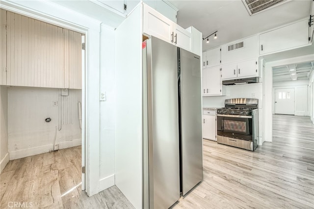 kitchen featuring light hardwood / wood-style floors, white cabinets, and stainless steel appliances