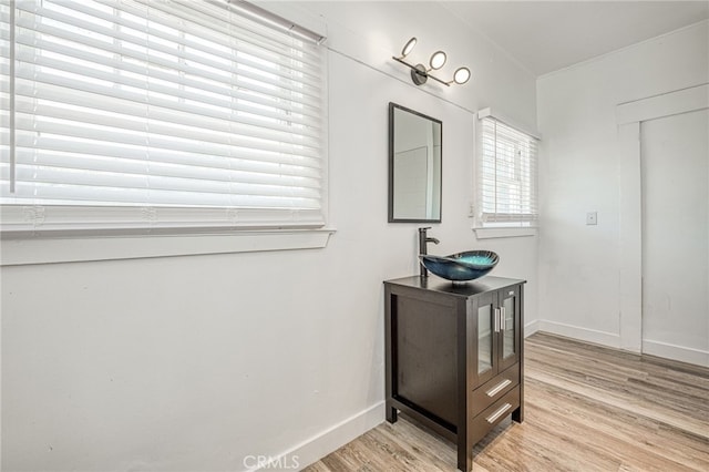 bathroom with vanity and hardwood / wood-style floors