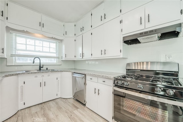 kitchen featuring light hardwood / wood-style floors, sink, white cabinetry, and stainless steel appliances