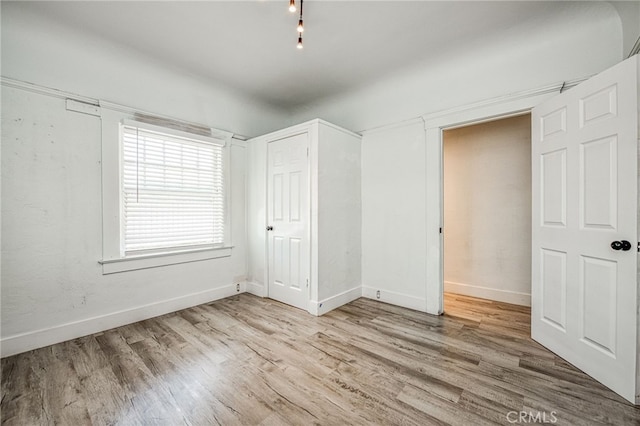 unfurnished bedroom featuring light hardwood / wood-style flooring