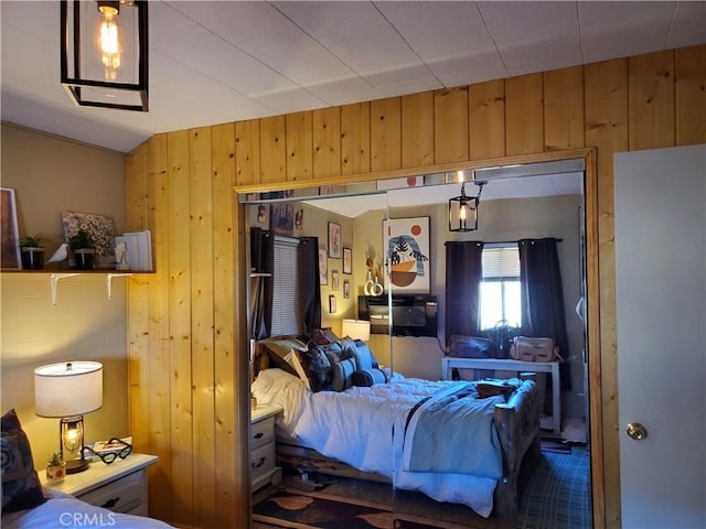 bedroom with wood walls