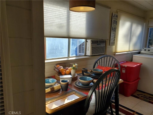 dining area featuring washer / clothes dryer, tile patterned flooring, and cooling unit