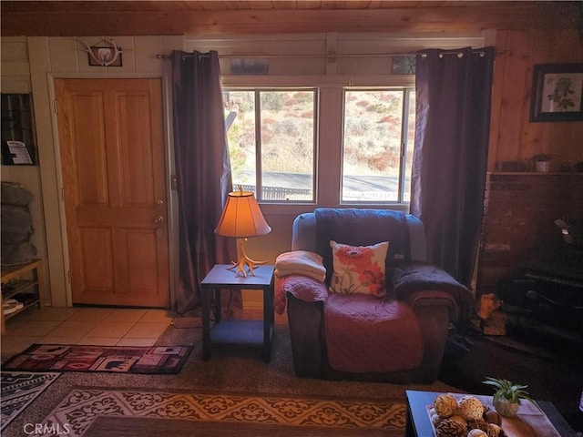 living area with tile patterned floors