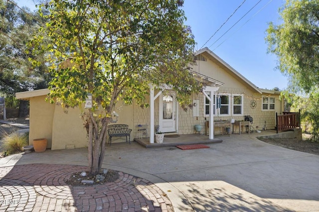 view of front of home with a patio