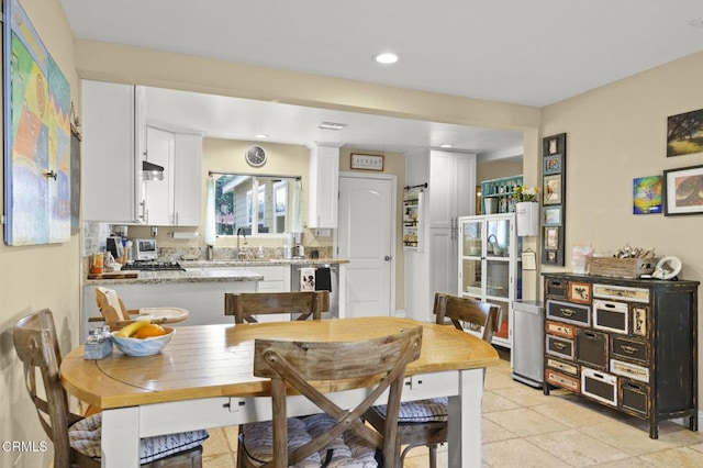 tiled dining space with sink