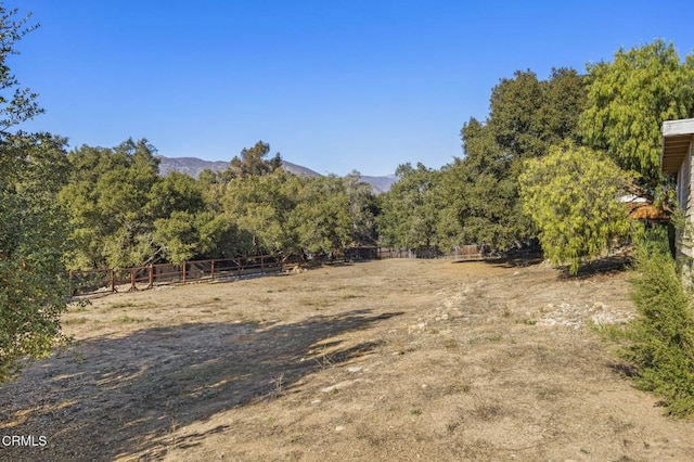 view of local wilderness featuring a mountain view and a rural view