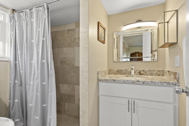 bathroom with vanity and walk in shower