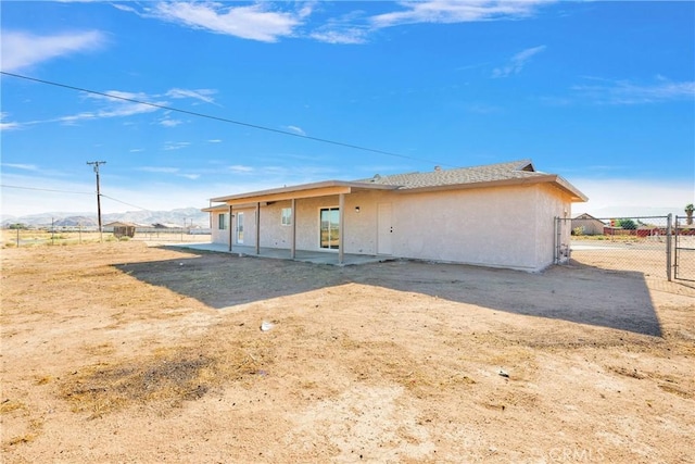 back of property featuring a mountain view