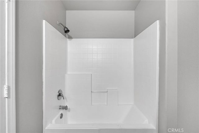 bathroom with shower / tub combination