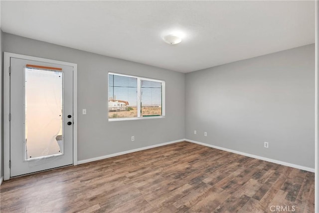 empty room featuring hardwood / wood-style flooring