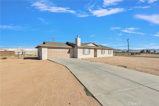 ranch-style house featuring a garage