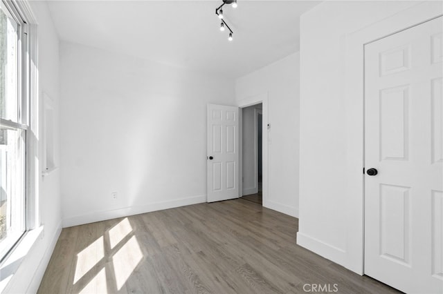 unfurnished bedroom with light hardwood / wood-style floors