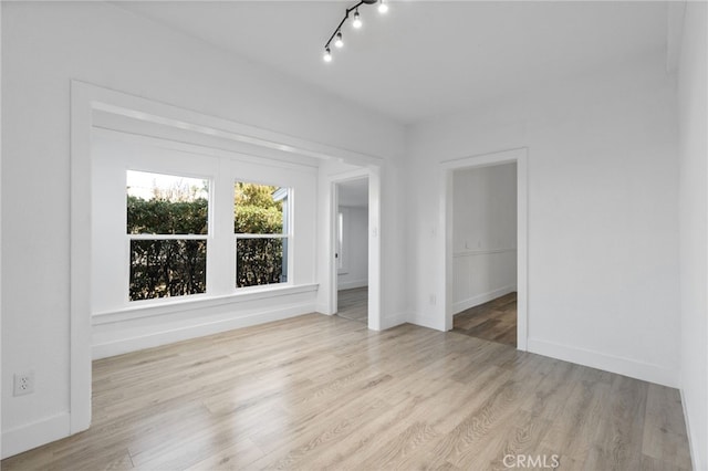 empty room with light hardwood / wood-style floors