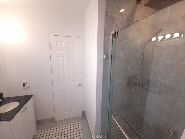 bathroom with vanity, tile patterned floors, and an enclosed shower