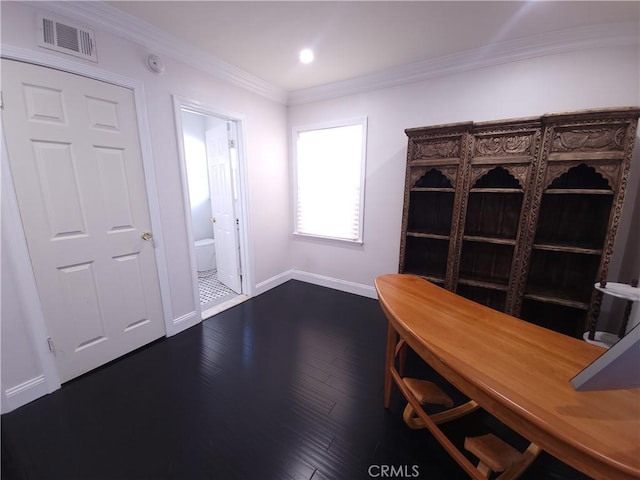 unfurnished office featuring dark hardwood / wood-style floors and crown molding