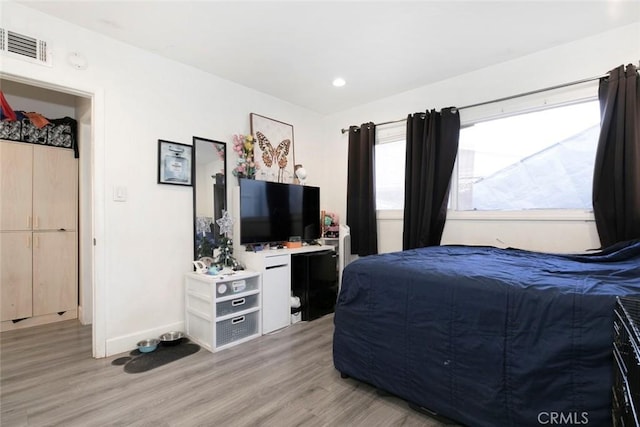 bedroom featuring light wood-type flooring