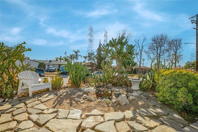 view of patio with an outdoor fire pit