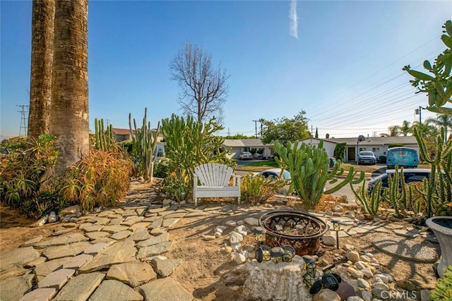 view of patio / terrace with an outdoor fire pit