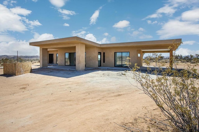 back of property featuring a patio area